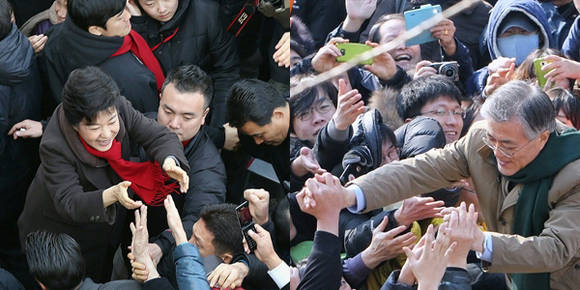 박근혜 후보가 제주 이도동 동문재래시장을 찾아 사진을 찍으려는 인파 사이로 유권자들과 악수하고 있다. / 문재인 후보가 11일 경기도 고양시 동구 라페스타 미관광장을 찾아 환호하는 경기도민들에게 손을 내밀어 인사하고 있다.