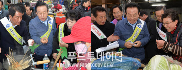 김관용 경남도지사가 전통시장을 돌며 물건을 구매해 보고 있다.